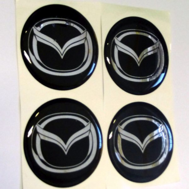 Znak Mazda priemer 55 mm, 4 ks Znak Mazda priemer 55 mm, 4 ks